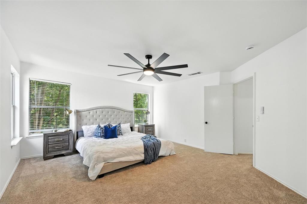 6218 Everglade Road Dallas, TX 75227 - Photo 24 of 39 Carpeted bedroom featuring ceiling fan and baseboards