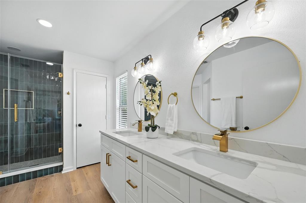 6218 Everglade Road Dallas, TX 75227 - Photo 25 of 39 Bathroom featuring double vanity, a shower stall, wood finished floors, and recessed lighting