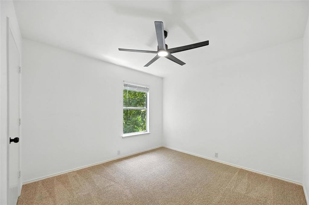 6218 Everglade Road Dallas, TX 75227 - Photo 28 of 39 Empty room featuring carpet and ceiling fan