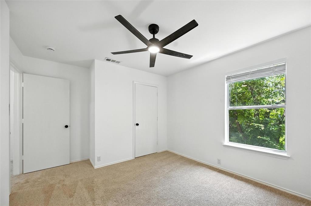 6218 Everglade Road Dallas, TX 75227 - Photo 29 of 39 Unfurnished bedroom with light colored carpet and ceiling fan
