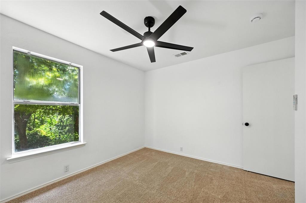 6218 Everglade Road Dallas, TX 75227 - Photo 32 of 39 Carpeted empty room with ceiling fan and a smoke detector