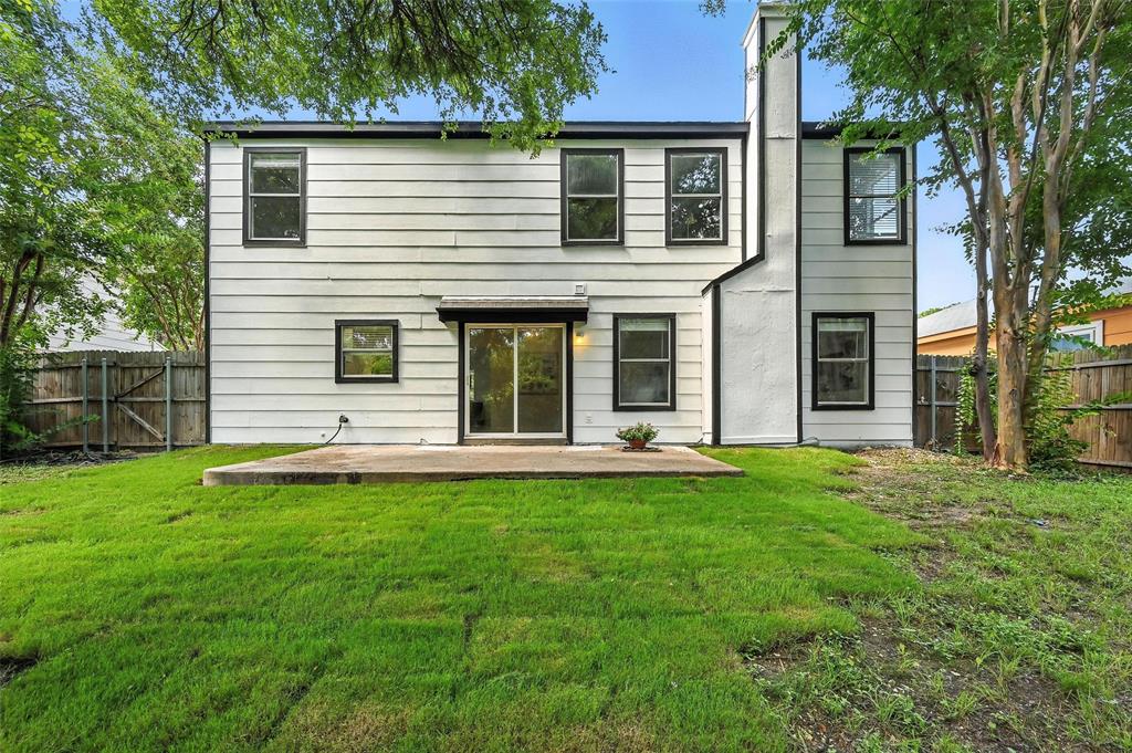 6218 Everglade Road Dallas, TX 75227 - Photo 34 of 39 Rear view of property featuring a patio area, a fenced backyard, and a chimney