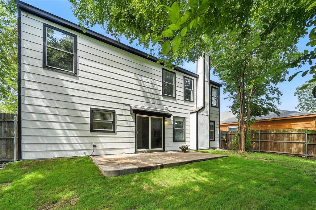 6218 Everglade Road Dallas, TX 75227 - Photo 36 of 39 Back of house featuring a fenced backyard, a patio, and a chimney