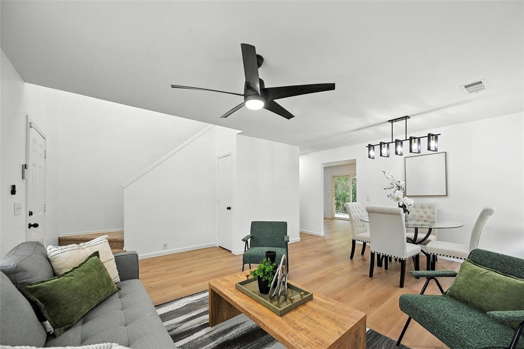 6218 Everglade Road Dallas, TX 75227 - Photo 4 of 39 Living room with light wood-style flooring and a ceiling fan