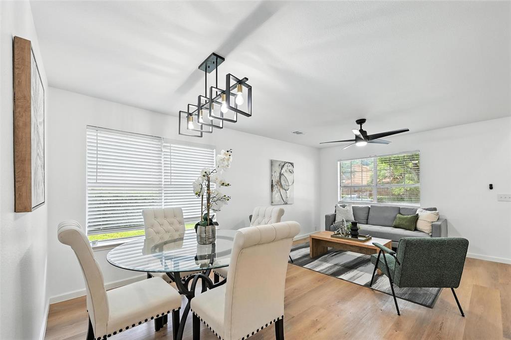 6218 Everglade Road Dallas, TX 75227 - Photo 7 of 39 Dining room with a ceiling fan and light wood finished floors