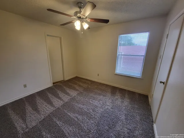 a view of a livingroom with a fan