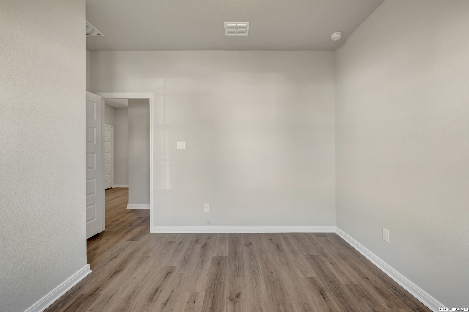 10330 Goodison Drive Converse, TX 78109 - Photo 17 of 42 a view of an empty room and wooden floor