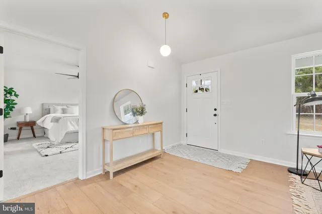 a spacious bedroom with a bed and a window