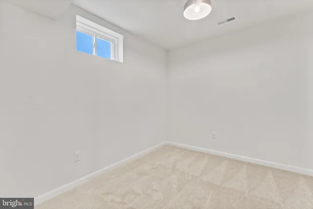 an empty room with a large window