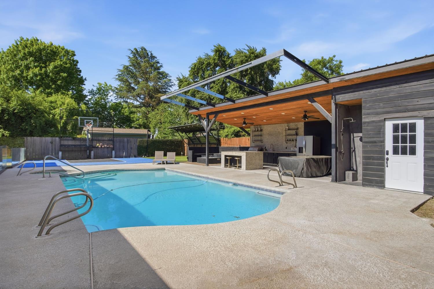10401 Golf Link Road Turlock, CA 95380 - Photo 41 of 63 swimming pool view with a seating space and garden view