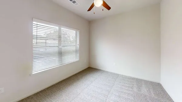 a close up view of a utility room with dryer and washer