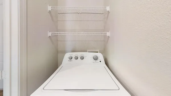 a kitchen with stainless steel appliances granite countertop a refrigerator stove and oven