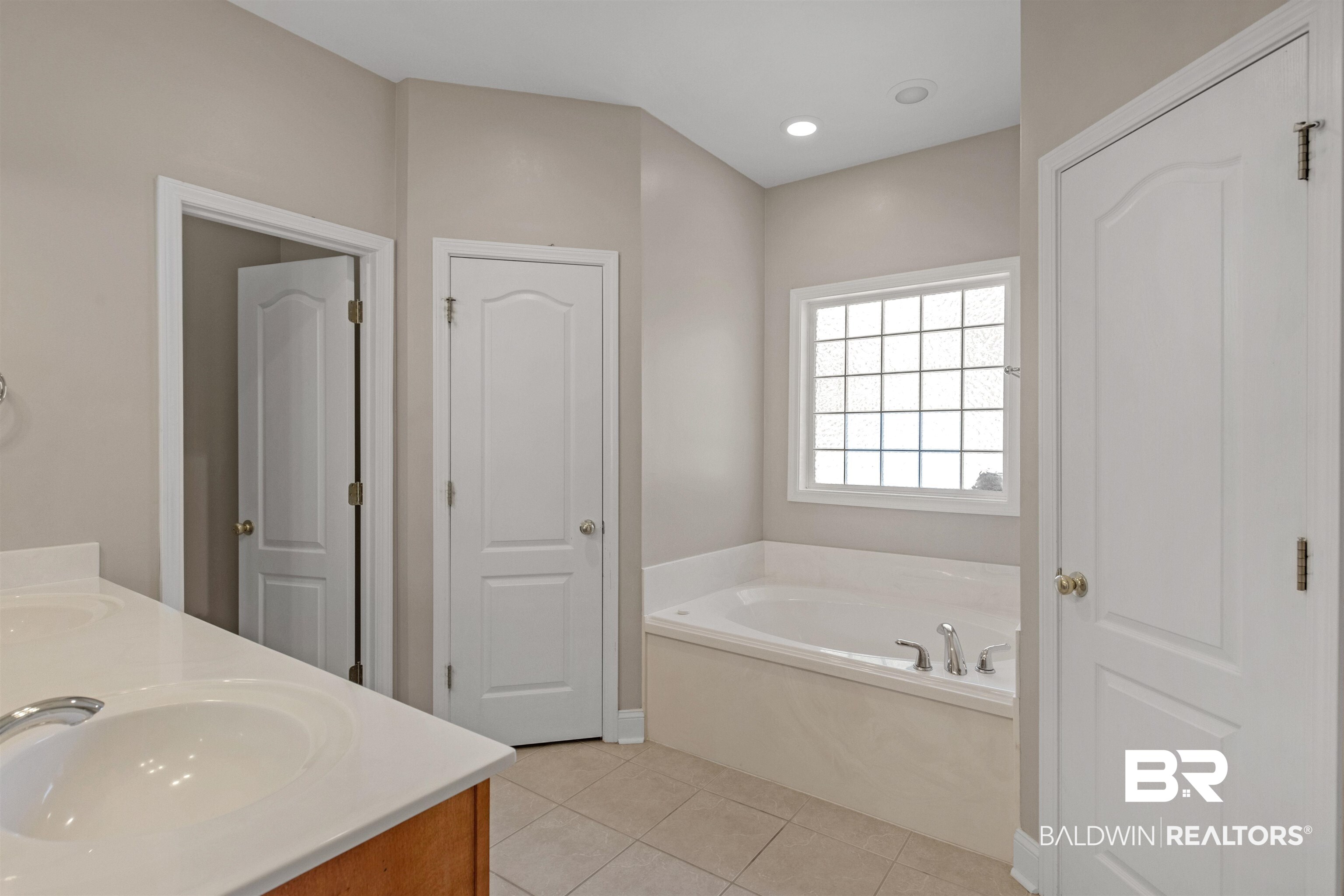 330 Allison Court Mobile, AL 36608 - Photo 14 of 27 Bathroom featuring tile patterned flooring, a bathing tub, and vanity
