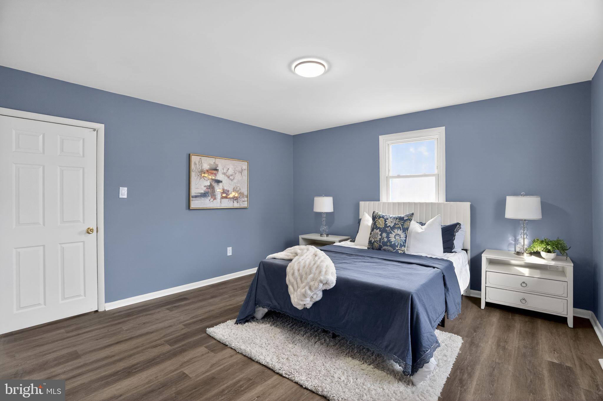218 East Somerdale Road Somerdale, NJ 08083 - Photo 16 of 30 a bedroom with a bed and wooden floor