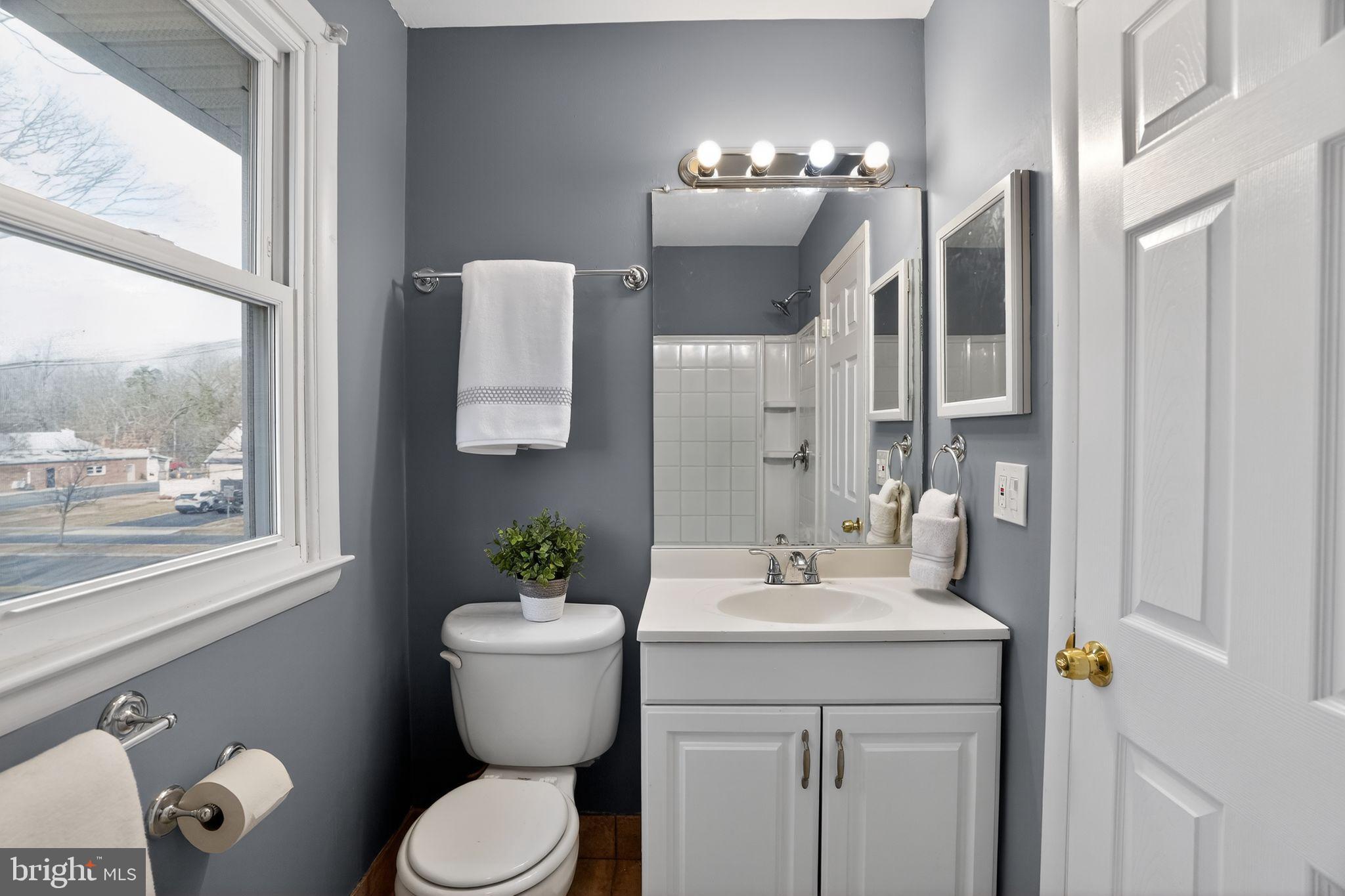 218 East Somerdale Road Somerdale, NJ 08083 - Photo 19 of 30 a bathroom with a sink and a mirror