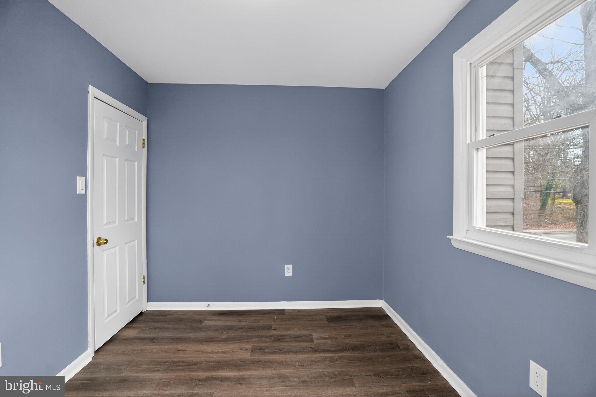 218 East Somerdale Road Somerdale, NJ 08083 - Photo 22 of 30 a view of an empty room with wooden floor and a window
