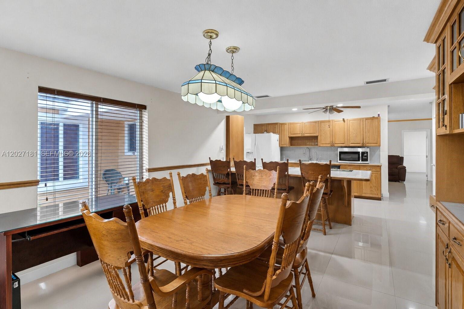 15440 Southwest 294th Terrace Homestead, FL 33033 - Photo 6 of 31 a view of a dining room with furniture window and outside view