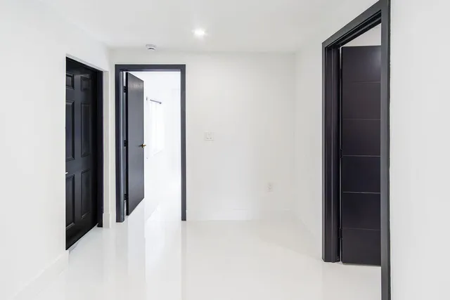 a view of an empty room with a window