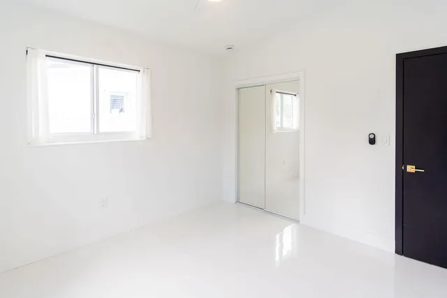 a bathroom with a sink a mirror and toilet