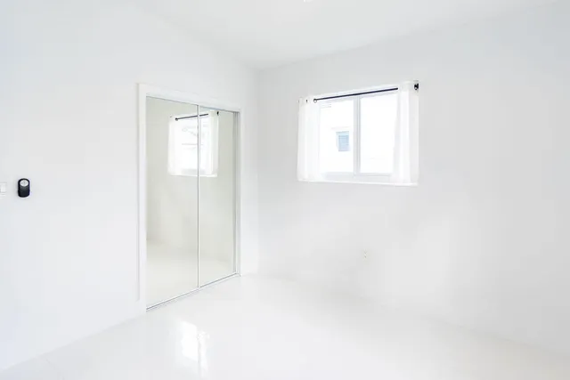 an aerial view of houses with yard