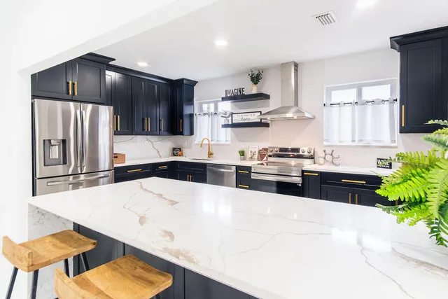 a kitchen with a sink a stove and refrigerator