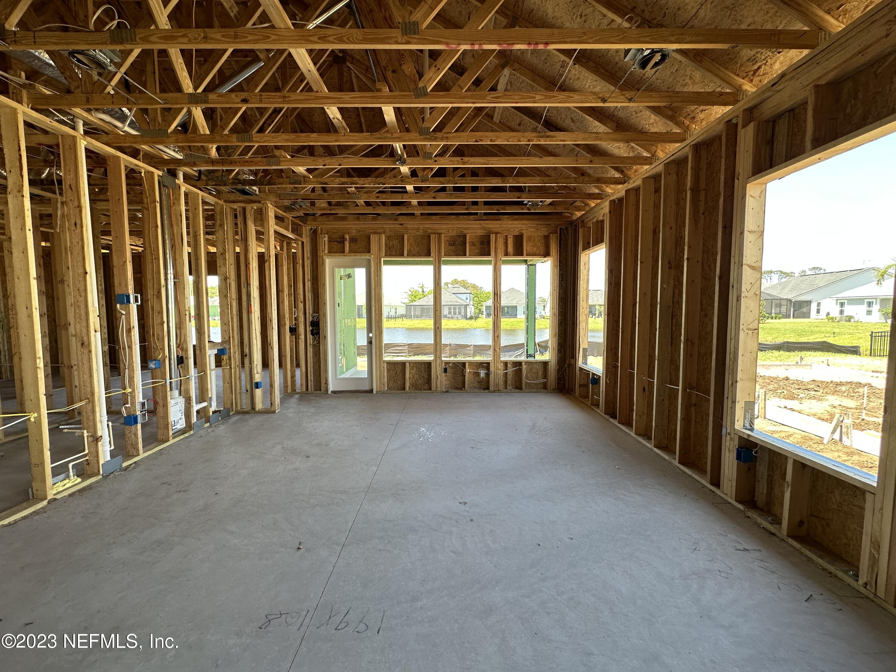 68 Amarante Lane St. Augustine, FL 32095 - Photo 9 of 31 a view of a room with wooden walls