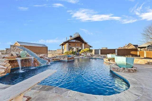 a view of a swimming pool with lounge chair