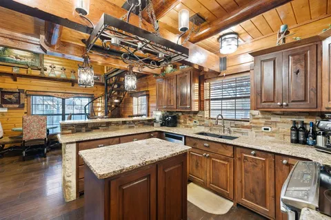 a kitchen with a sink and cabinets