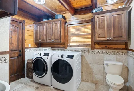 a bathroom with a toilet next to a window