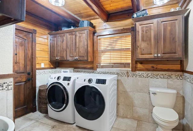 a bathroom with a toilet next to a window