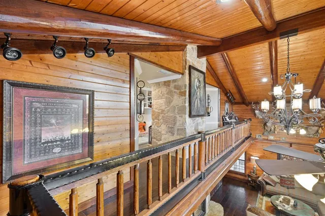 a bedroom with a bed and dresser with mirror