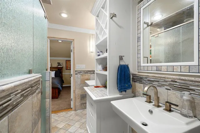 a view of an empty room with a ceiling fan