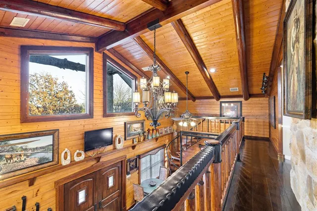 a view of a house with pool and sitting area