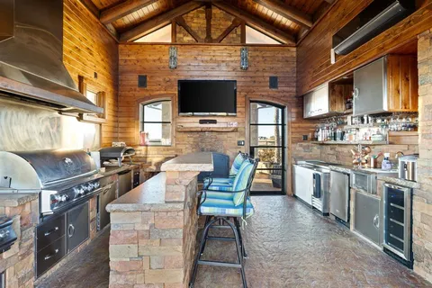 a view of yard from dining room with furniture