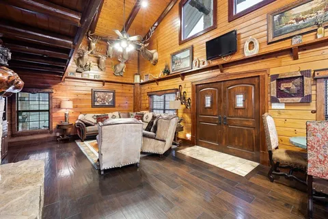 a view of a patio with table and chairs with wooden floor