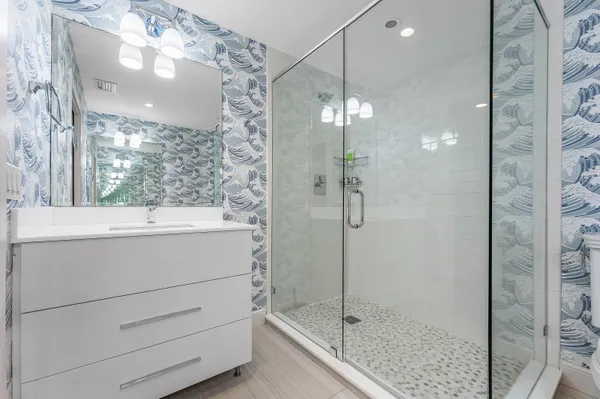 a view of a garden with potted plants and large trees