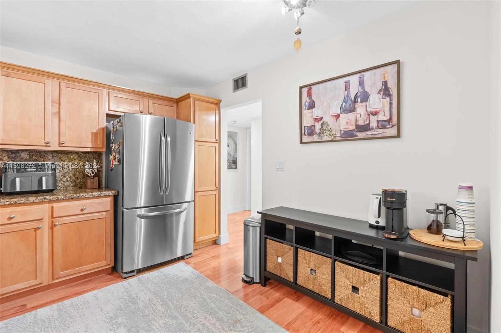 605 Ives Dairy Road, Unit 3047 Miami, FL 33179 - Photo 14 of 39 a kitchen with stainless steel appliances a refrigerator and a stove top oven