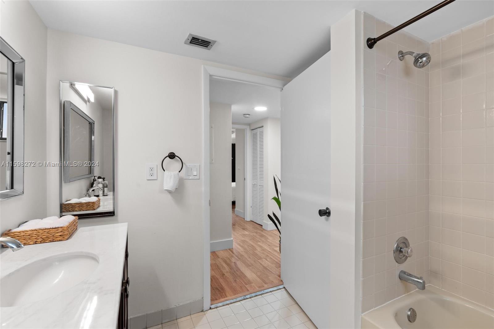 605 Ives Dairy Road, Unit 3047 Miami, FL 33179 - Photo 20 of 39 a bathroom with a tub and shower