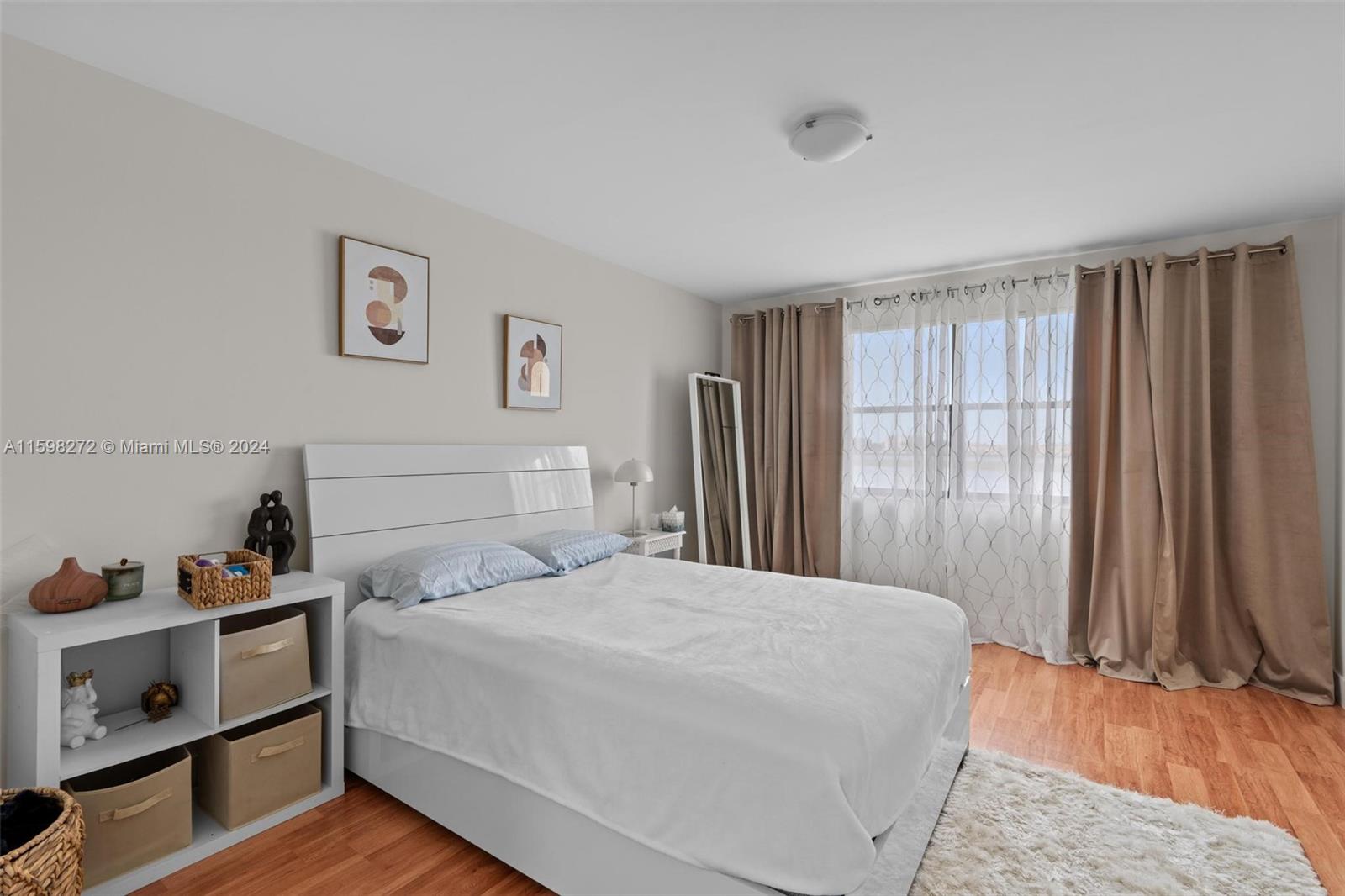 605 Ives Dairy Road, Unit 3047 Miami, FL 33179 - Photo 22 of 39 a bedroom with a bed and a window