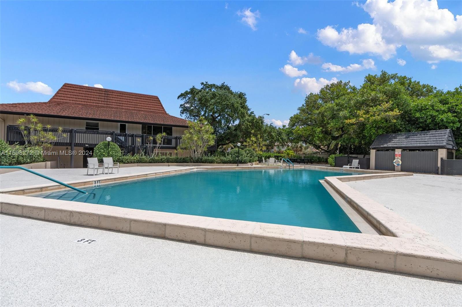 605 Ives Dairy Road, Unit 3047 Miami, FL 33179 - Photo 34 of 39 a view of a house with a swimming pool