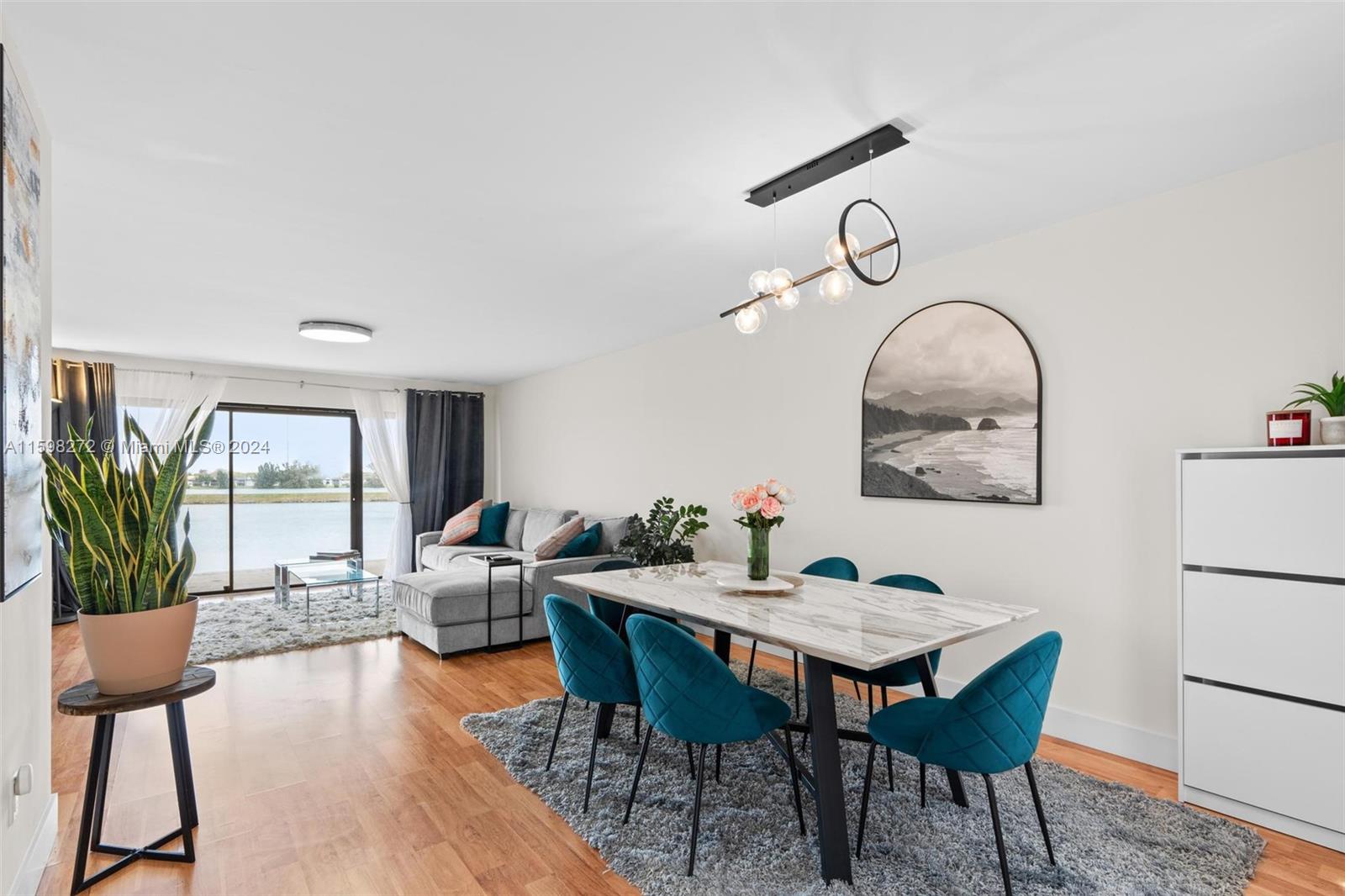 605 Ives Dairy Road, Unit 3047 Miami, FL 33179 - Photo 9 of 39 a view of a dining room with furniture window and wooden floor