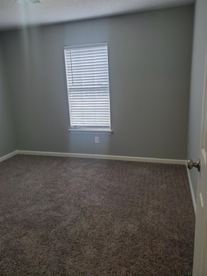 6748 State Line Road Memphis, TN 38141 - Photo 11 of 14 an empty room with a window