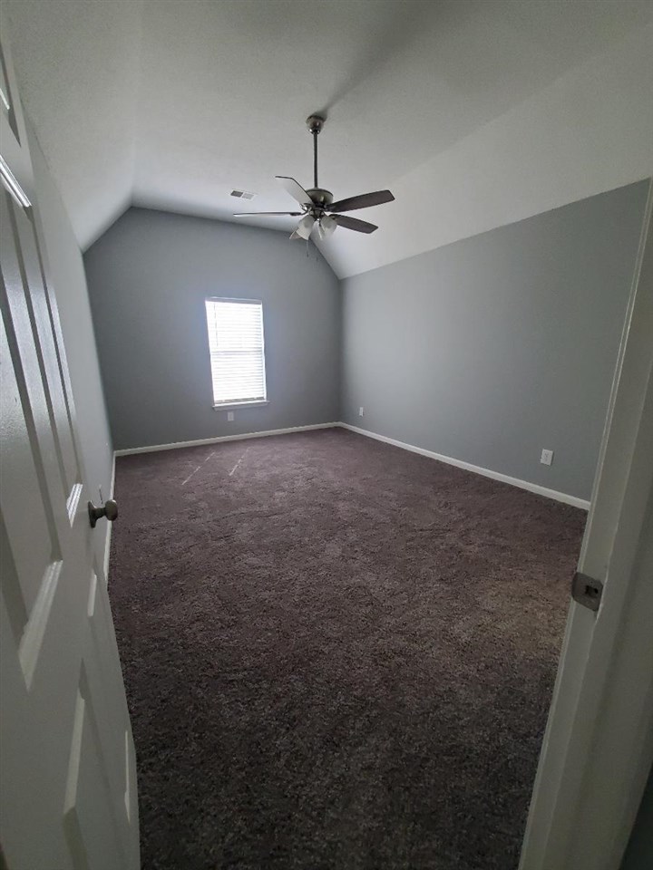 6748 State Line Road Memphis, TN 38141 - Photo 6 of 14 wooden floor in an empty room with a window