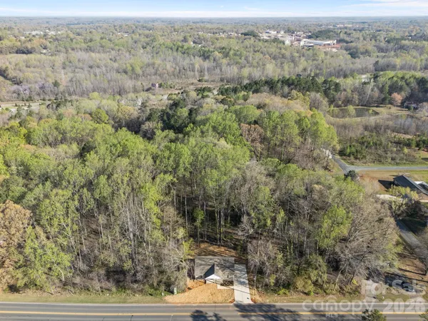 an aerial view of house with yard