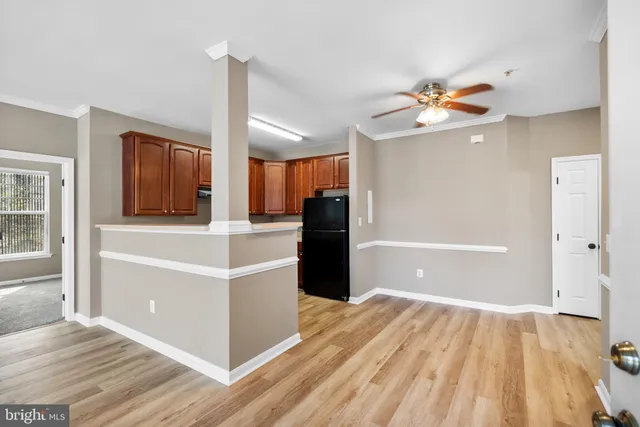 a kitchen with granite countertop a stove top oven and cabinets
