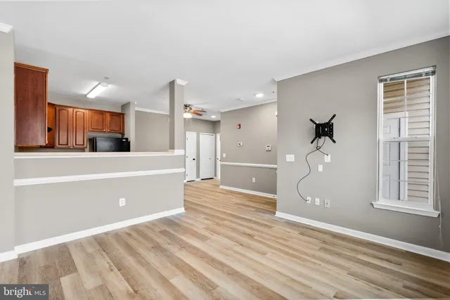 a spacious bathroom with a tub and mirror