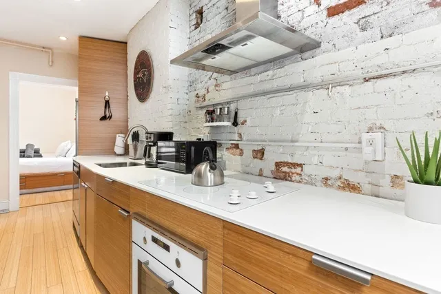a bathroom with a sink double vanity and a tub