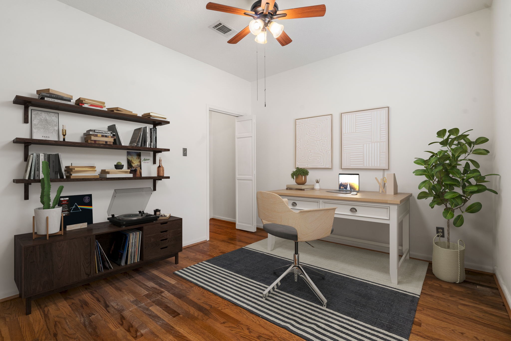 6403 Willow Pine Drive Spring, TX 77379 - Photo 13 of 40 Work from home in style! This inviting office space boasts gleaming hardwood floors, abundant natural lighting from large windows, and sophisticated custom trim design.