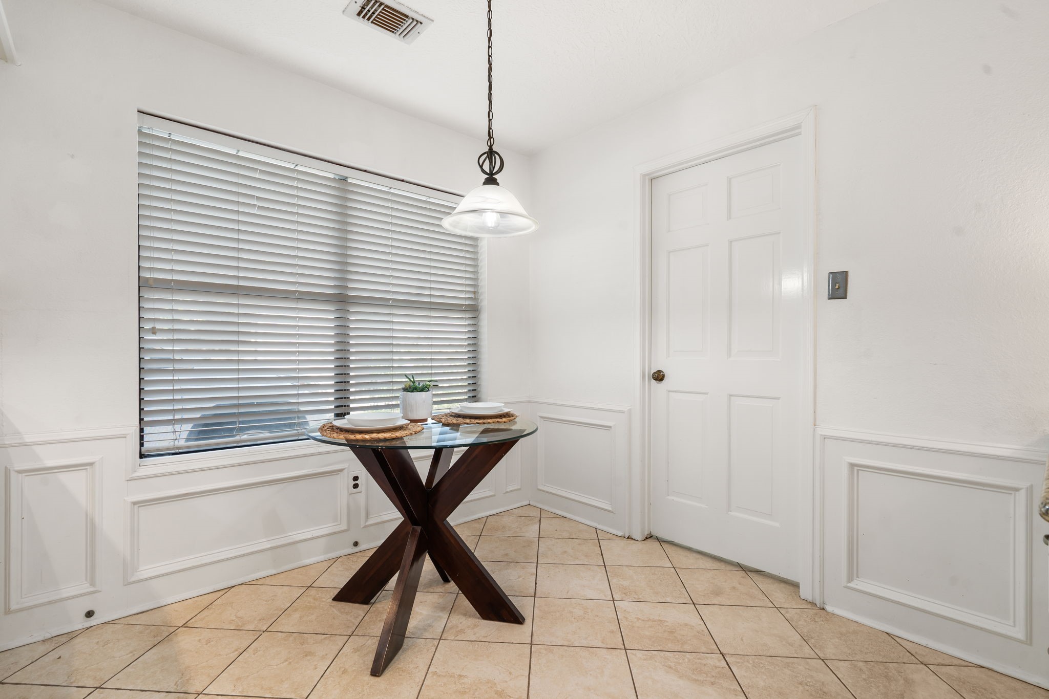 6403 Willow Pine Drive Spring, TX 77379 - Photo 18 of 40 Enjoy casual meals here. The space is accented with classic wainscoting and offers bright views through the large window.