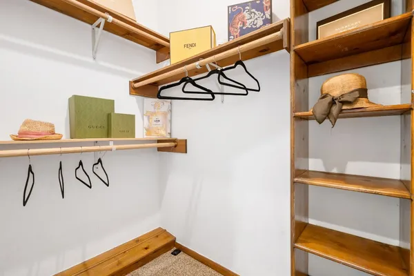 a view of storage and utility room with a mirror